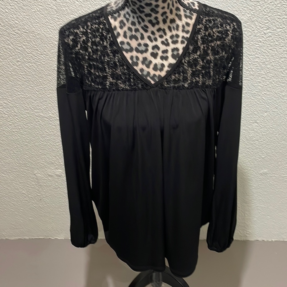 Michael Kors beautiful black and shear top blouse. Single button closure in back